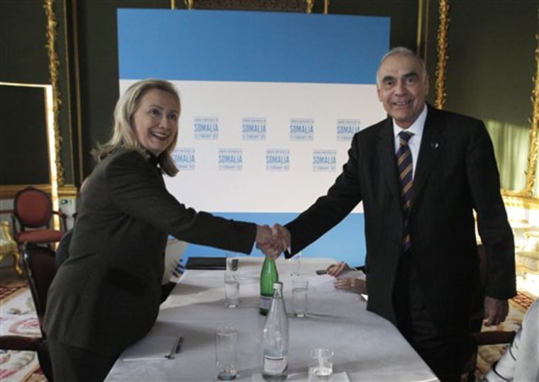 U.S. Secretary of State Hillary Rodham Clinton shakes hands with Egypt's Foreign Minister Mohammed Amr, right, at the London Conference on Somalia, Thursday Feb. 23, 2012.  World leaders pledged new help to Somalia to tackle terrorism and piracy, but insisted Thursday that the troubled east African nation must quickly install a permanent government and threatened penalties against those who hamper political progress.  (AP Photo/Jason Reed, Pool)
